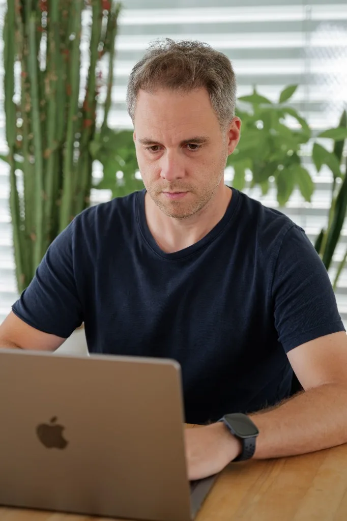 Patrick Christen focused at his laptop